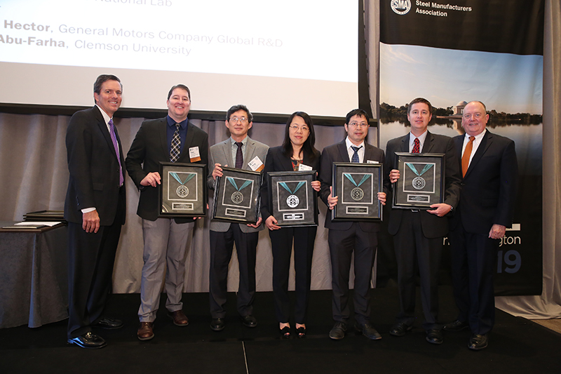 (L-R) Roger Newport, Chairman, AISI, Chief Executive Officer, AK Steel Corporation; Tyson Brown, General Motors Company; Yang Ren, Argonne National Lab; Xin Sun, Oak Ridge National Lab; Xiaohua Hu, Oak Ridge National Lab; Grant Thomas, AK Steel; Thomas J. Gibson, President and CEO, AISI